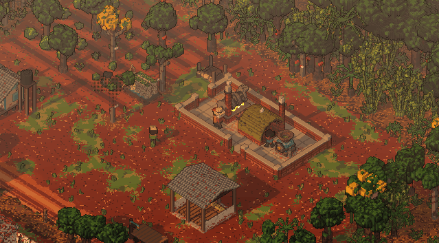 Golden hour: long shadows across the red earth and a warm haze over the forest.